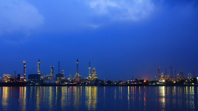 River and oil refinery factory with reflection