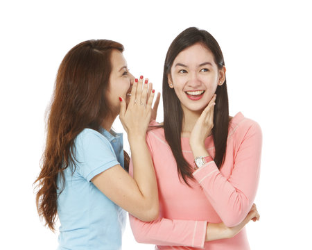 Young Women Whispering