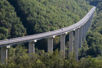 The viaduct over canyon in Ligurian Alps, Italy - obrazy, fototapety, plakaty