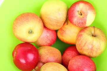 Fresh green, red apples in basket
