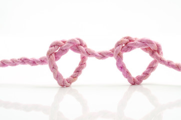 pink rope heart shaped symbol