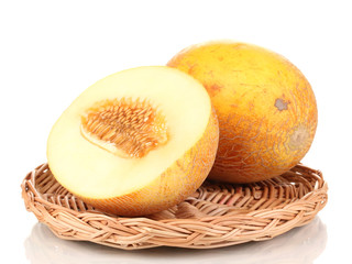 Ripe melons on wicker cradle isolated on white