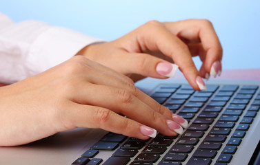 business woman's hands typing