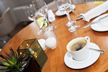 Cup of coffee on wooden table