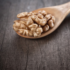 walnut in wooden spoon