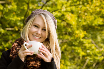 Beautiful smiling Girl with Cup