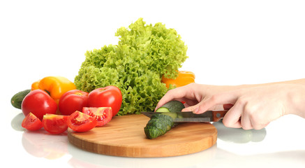 woman hands cutting vegetables on kitchen blackboard
