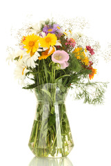 Fototapeta na wymiar beautiful bouquet of bright wildflowers in glass vase,