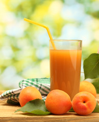 glass of apricot juice and fresh apricots