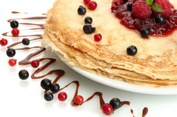 Delicious pancakes with berries and jam