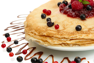 Delicious pancakes with berries and jam