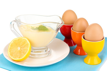 Mayonnaise in bowl on napkin isolated on white