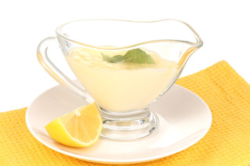 Mayonnaise in bowl on napkin isolated on white