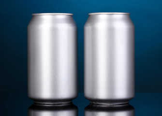 aluminum cans on blue background
