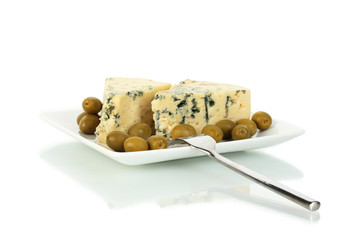 Cheese with mold and olives on the plate isolated on white