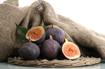 Ripe sweet figs with leaves isolated on white