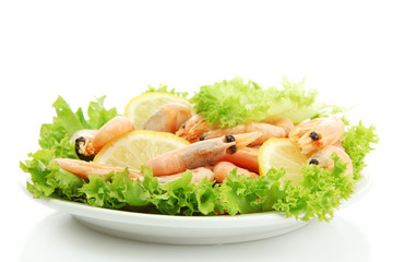 Boiled shrimps with lemon and lettuce leaves