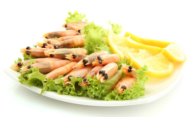 Boiled shrimps with lemon and lettuce leaves