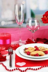 Table setting in honor of Valentine's Day on room background