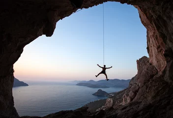 Fototapeten Rock climber at sunset, Kalymnos Island, Greece © Andrey Bandurenko