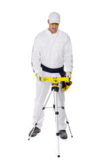 construction worker in white coveralls level tool