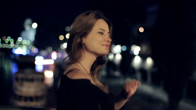 Young happy woman walking in the city, steadicam shot