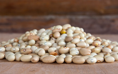 Hill of beans on the wooden table