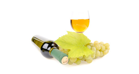 bottle of wine with glass and green grapes