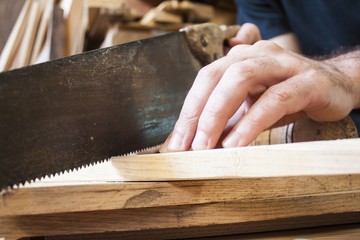 saw on carpentry wooden background