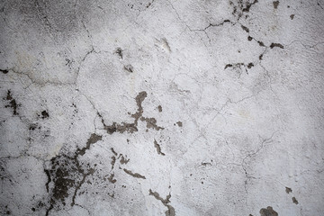 The gray concrete wall in the cracks Abstract