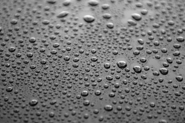 Waterdrops on a polished lacquer surface
