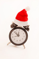 alarm clock with christmas santa hat on