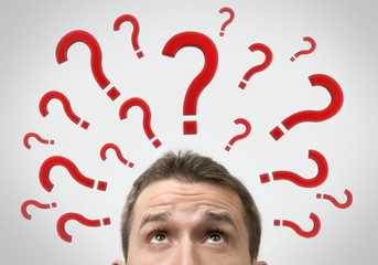 Man thinking concept with question marks close up