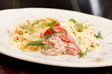 Scrambled eggs with bacon and tomato