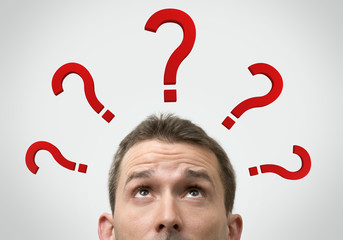 Man thinking concept with question marks close up