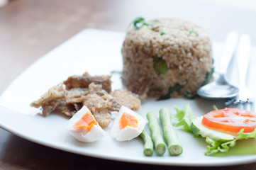 spicy fried rice with fried fish with salted egg