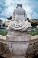 Statue on a beautiful old fountain in the south of italy