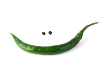green chili pepper forming a funny face with happy smile