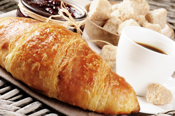 Breakfast with coffee, French croissant and jam