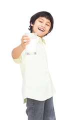 Smiling asian boy with a glass of milk