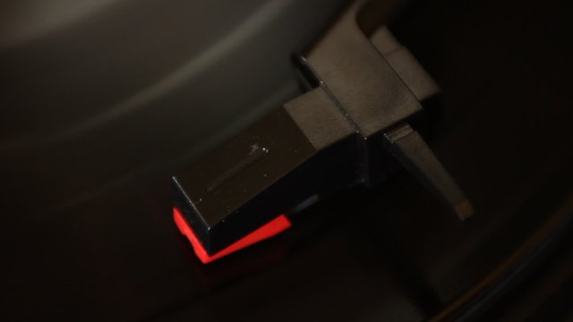 Detail of cartridge on spinning vinyl