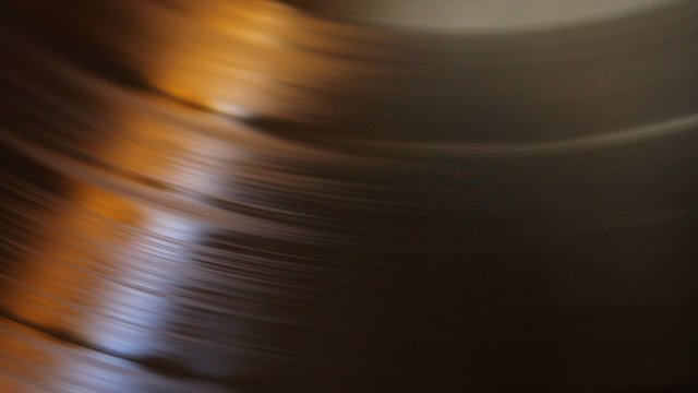 Pan of a spinning vinyl and cartridge