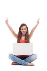 Woman with laptop showing thumbs up