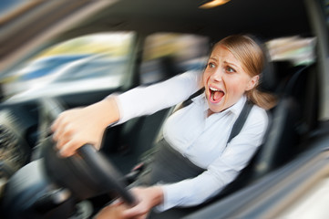 female driving the car and screaming