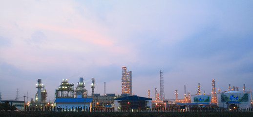 Column tower in petrochemical plant at twilight