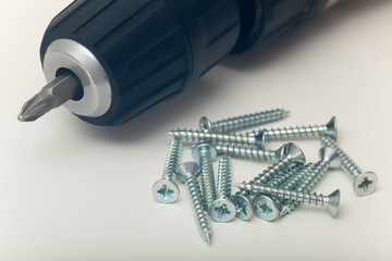 Screws and hand drill