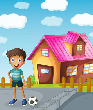 a boy, football and house