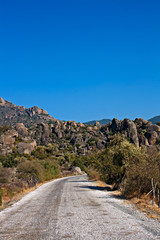 Roadway through unusual rock formations on mountain side