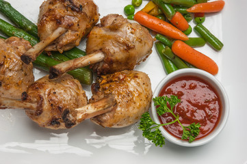chicken legs with asparagus and ketchup