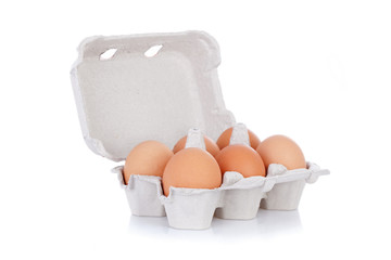 Half dozen  brown chicken eggs in box isolated
